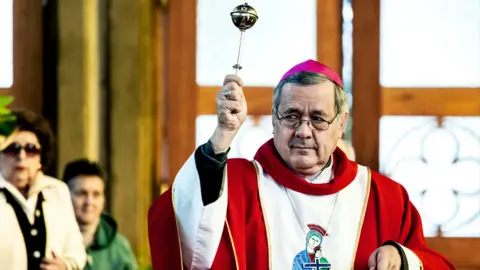 Getty Images Bishop Juan Barros leads a mass of Palm Sunday in March 2018