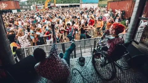 Mark Anthony Krayz-Legz performing at Boomtown