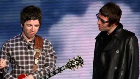 Getty Images Brothers Noel and Liam Gallagher pictured together in 2009, the year Oasis split