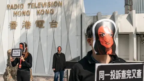Getty Images RTHK staff wearing Nabela Qoser masks