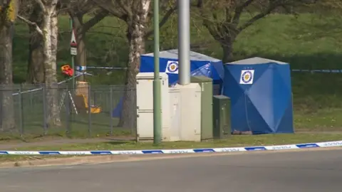 Blue tents at the scene on Arran Way