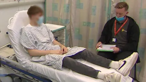 BBC Youth worker with young person