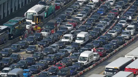 PA Media Holiday traffic queues to check-in for ferries at the Port of Dover, Kent