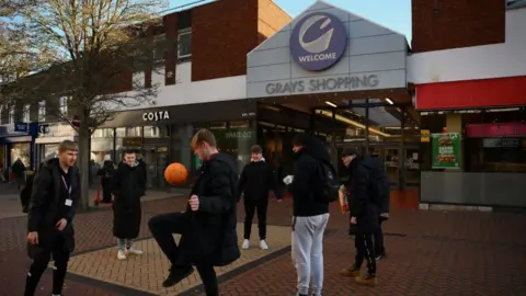 Getty Images Boys playing football in Grays high street