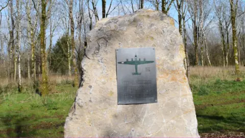 The Blagdon History Society The new plaque honouring the crew of the US bomber who died at Blagdon, with a plane in the centre