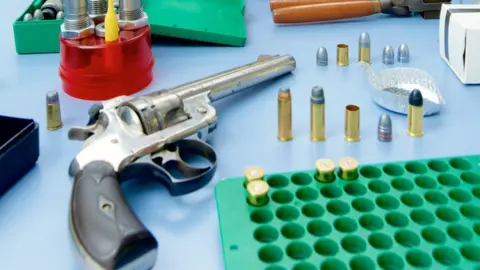 West Midlands Police Guns and bullets on a table