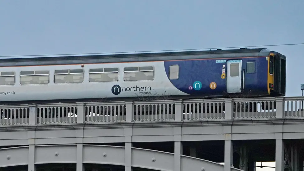 PA Media A Northern train travels along the High Level Bridge which carries both rail and road traffic across the Tyne between Newcastle upon Tyne and Gateshead