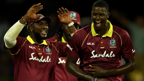 Jason Holder celebrates