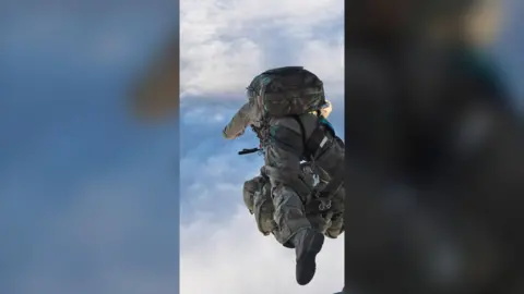 A military officer mid-skydive 