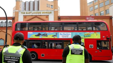 Reuters/Toby Melville Security officers patrol near East London mosque