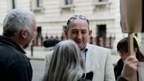 Simon Delow filmed at protest