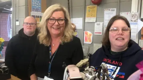 BBC Sharon Jones with students at the store