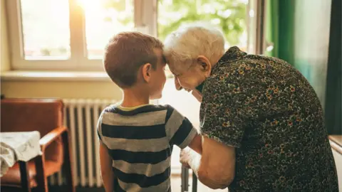 Getty Images A boy and his great grandmother