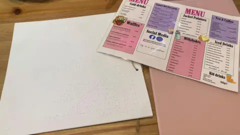 The image shows a braille menu on the left and the original menu on the right