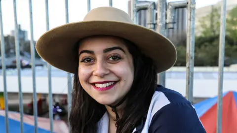 Hewyllyn Carrao watching the rodeo