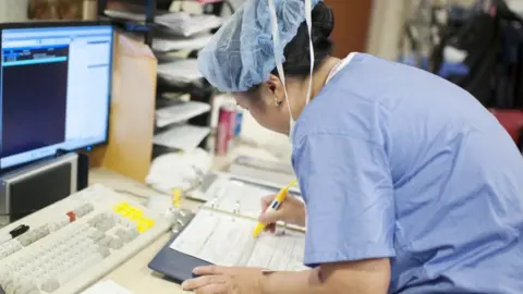 Getty Images Nurse at a desk