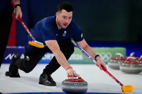 Getty Images Hammy McMillan playing a shot during the Winter Olympics in Milan Cortina.