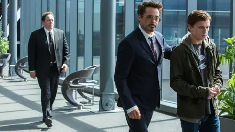 Sony Pictures Jon Favreau, Robert Downey Jr and Tom Holland in Spider-Man: Homecoming