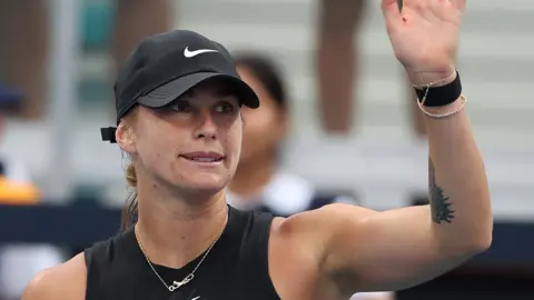 Aryna Sabalenka waves to the Miami crowd
