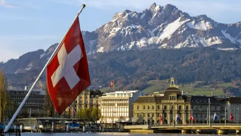 Getty Images A Swiss flag in the Swiss city of Lucerne