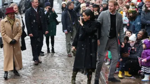 Reuters Crowds greet the Duke and Duchess of Sussex