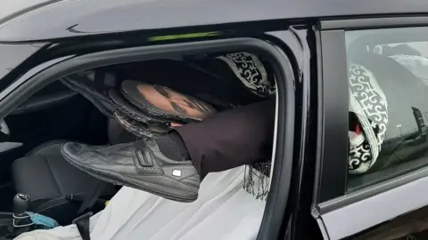 Cambridgeshire Police The mannequin's feet poking out of carpet