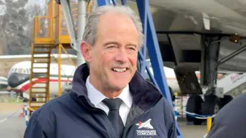 Former Concorde pilot, John Tye at Brooklands Museum which has the first British production Concorde used for certification (G-BBDG)