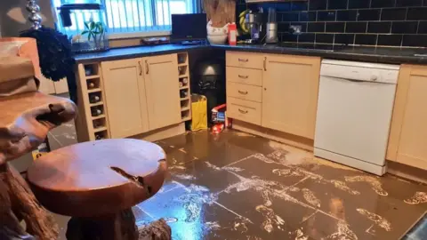 Flooded kitchen aftermath