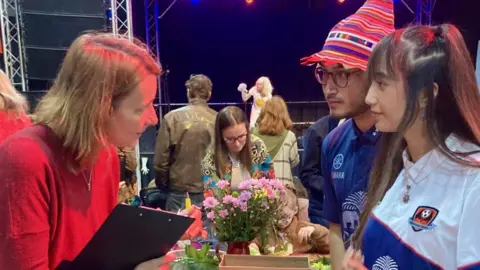 Somerset Diverse Communities a woman talking to two people