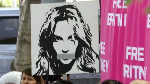 poster featuring Britney Spears with tape over her mouth