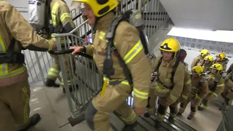 BBC Firefighters walking up stairs