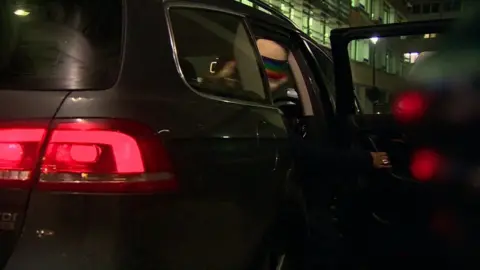 BBC Passenger getting into private hire vehicle