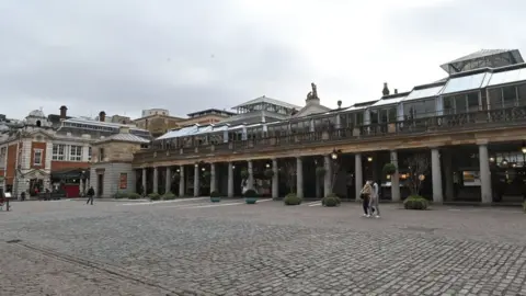 JUSTIN TALLIS/Getty Images A near-empty Covent Garden in London