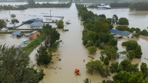 Getty Images Rescue boat in flooded streets of Awatoto near the city of Napier. Taken on February 14.