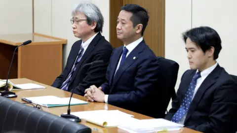 Getty Images Members of Carlos Ghosn's legal team including chief lawyer Motonari Otsuru (left) Go Kondo (centre) and Masato Oshikubo (right)