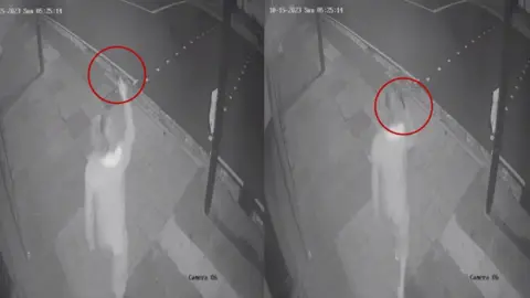 PA Media CCTV footage of Alid in the street holding a knife