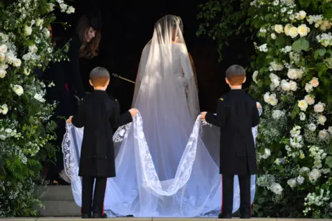 Getty Images Meghan Markle arrives for the wedding ceremony to marry Prince Harry at St George"s Chapel, Windsor Castle