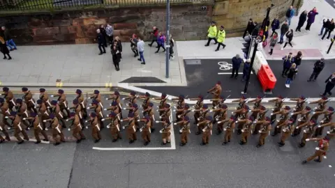 PA Media 1st Battalion of The Duke Of Lancaster's Regiment march through the streets of Liverpool