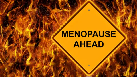 Getty Images Menopause ahead caution sign