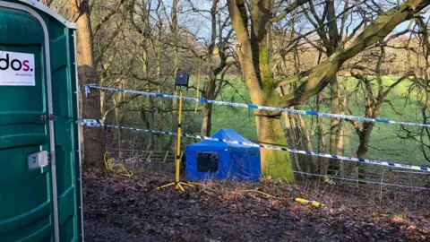 Police tape and tent