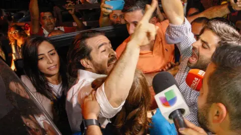 EPA former san cristobal mayor Daniel Ceballos greets supporters after his release