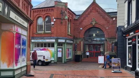 Signage on closed shops promote the City of Culture bid