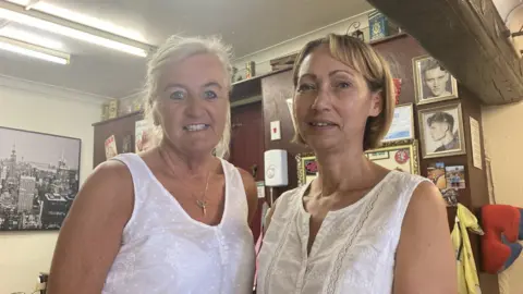 Neve Gordon-Farleigh Christine Patrick and Beverley Hindmarsh inside their shop