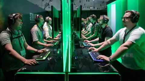 FRIEDEMANN VOGEL/EPA-EFE/REX/Shutterstock Gamers playing a games conference