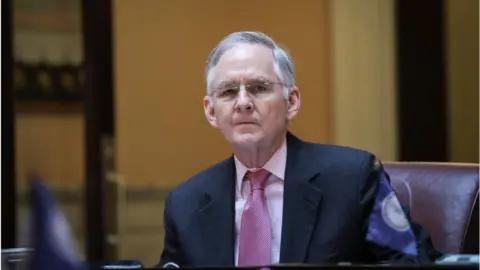 Getty Images Tommy Norment sits at his desk on the Senate floor