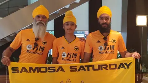 PA Media Manny Singh Kang with Samosa Saturday flag