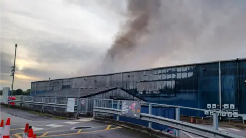 BBC Smoke coming out of a recycling centre