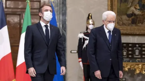 EPA/QUIRINALE A handout photo made available by Quirinale Palace shows Italian President Sergio Mattarella and French President Emmanuel Macron during their meeting at Quirinale Palace in Rome, Italy, 25 November 2021