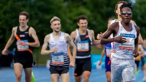 Nick Griggs (second from left) took third in the Morton Mile won by South Africa's Ryan Mphahlele