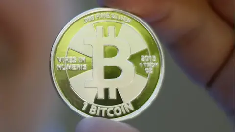 Reuters A tangible example of the virtual currency bitcoin